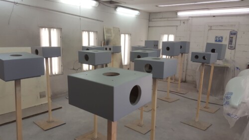 Half modules getting painted with primer for the first photo shoot